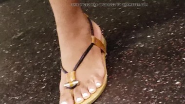 Candid ebony feet in sandals